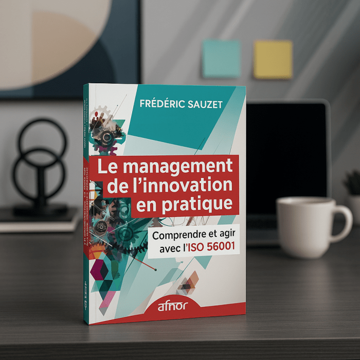 Le livre est posé sur une table de conférence avec des chaises autour, un tableau blanc ou un écran de présentation en arrière-plan affichant des graphiques ou des idées d'innovation. Cela évoque un cadre collaboratif et stratégique.